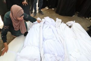 Israel kills more than 70 in Gaza, including 16 in bombing family building
